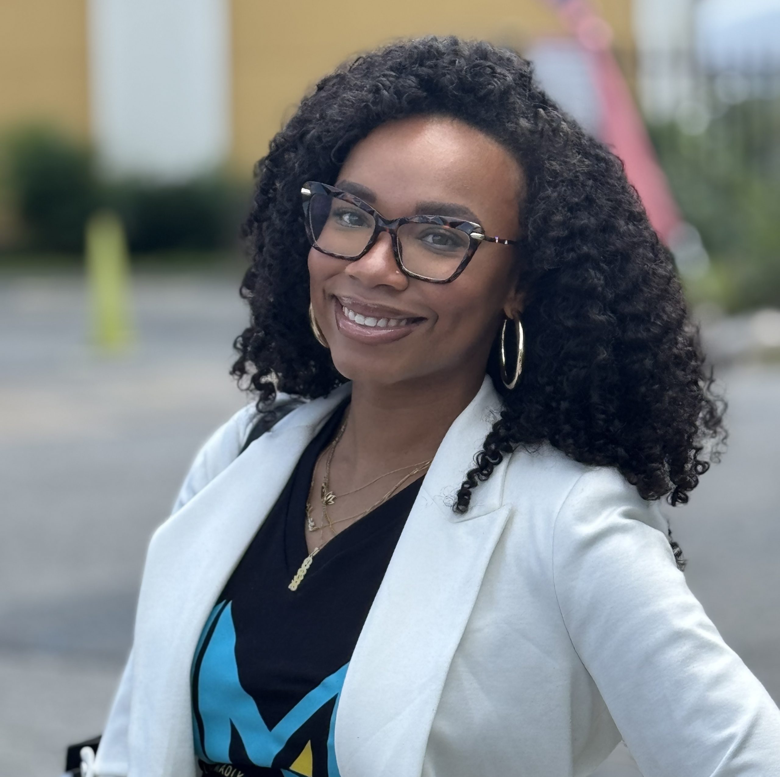Blue turtleneck, black woman, dreads, natural, blazer